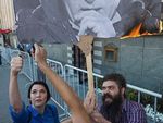 Сжегших портрет Путина активистов осудили за сопротивление полиции